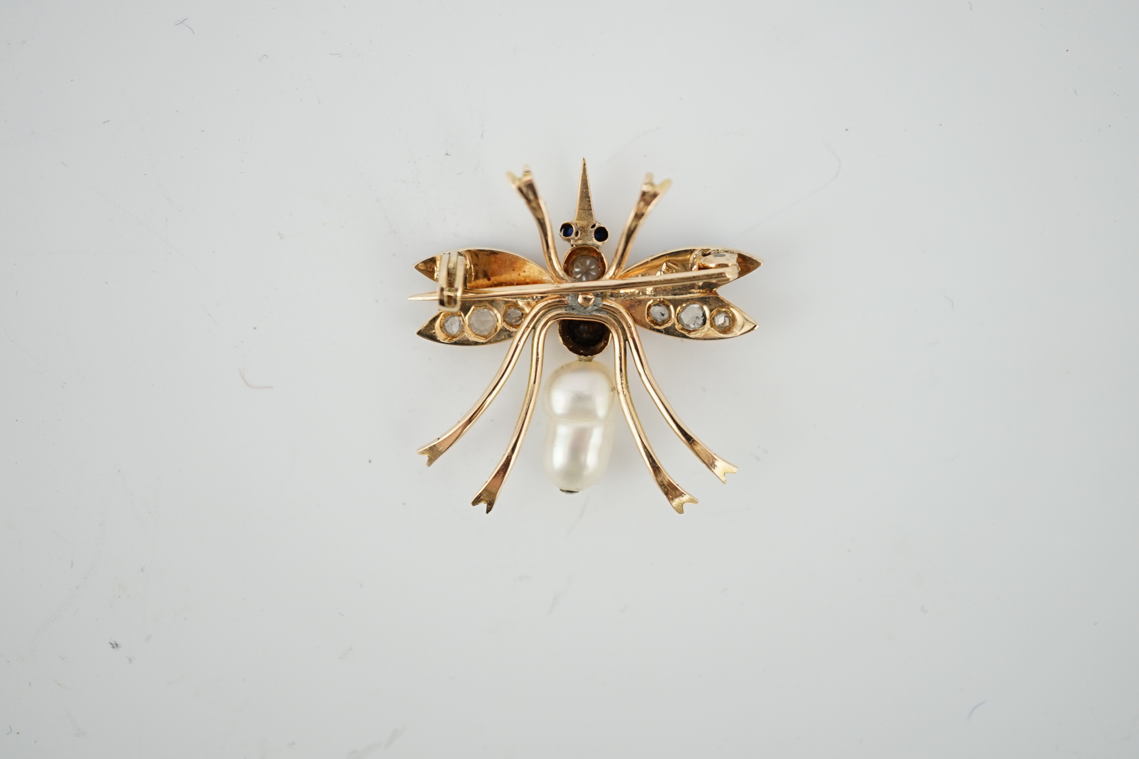 A Victorian style gold, baroque pearl, enamel, diamond and sapphire? set bug brooch